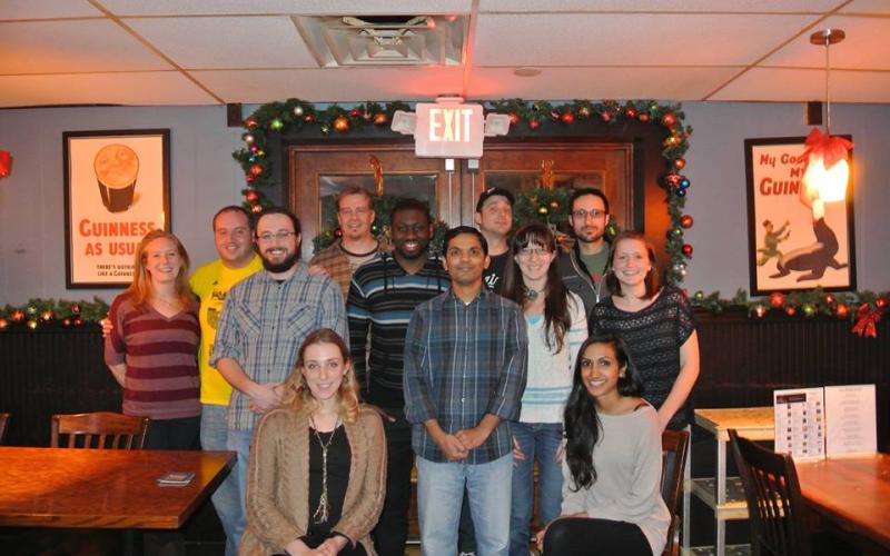 Former and current group members gather to celebrate the holidays in 2013.
